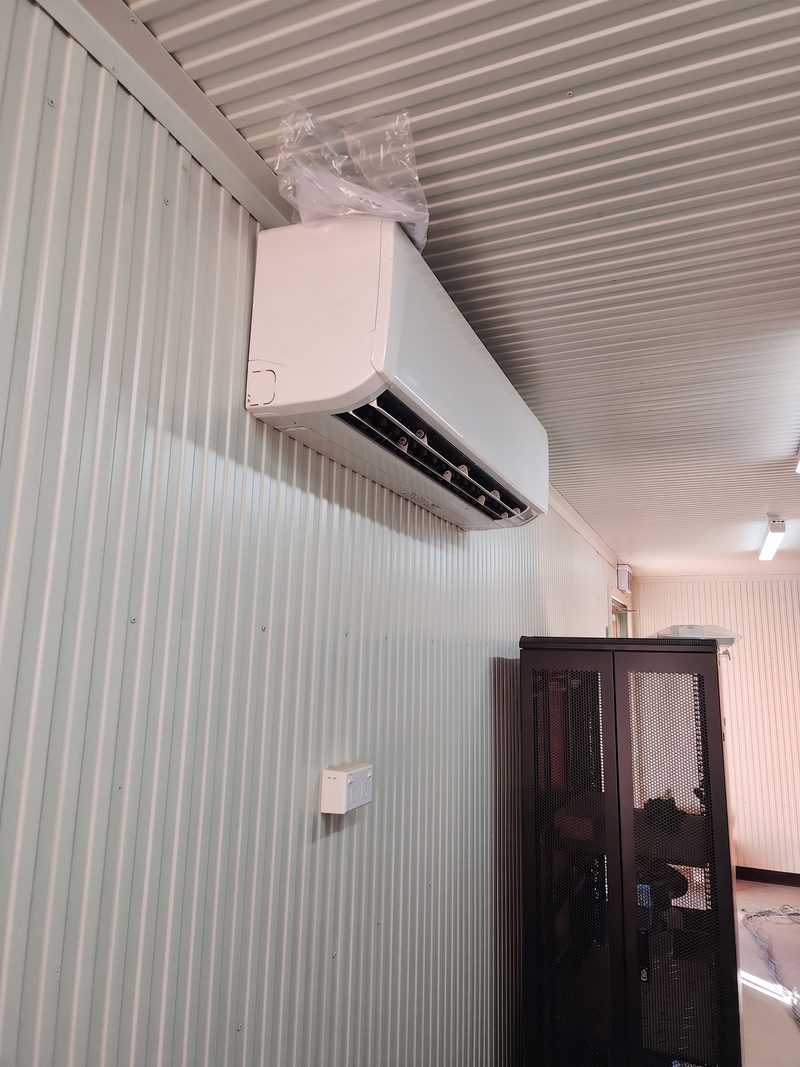 Split system and comms cabinet in a site office fit-out