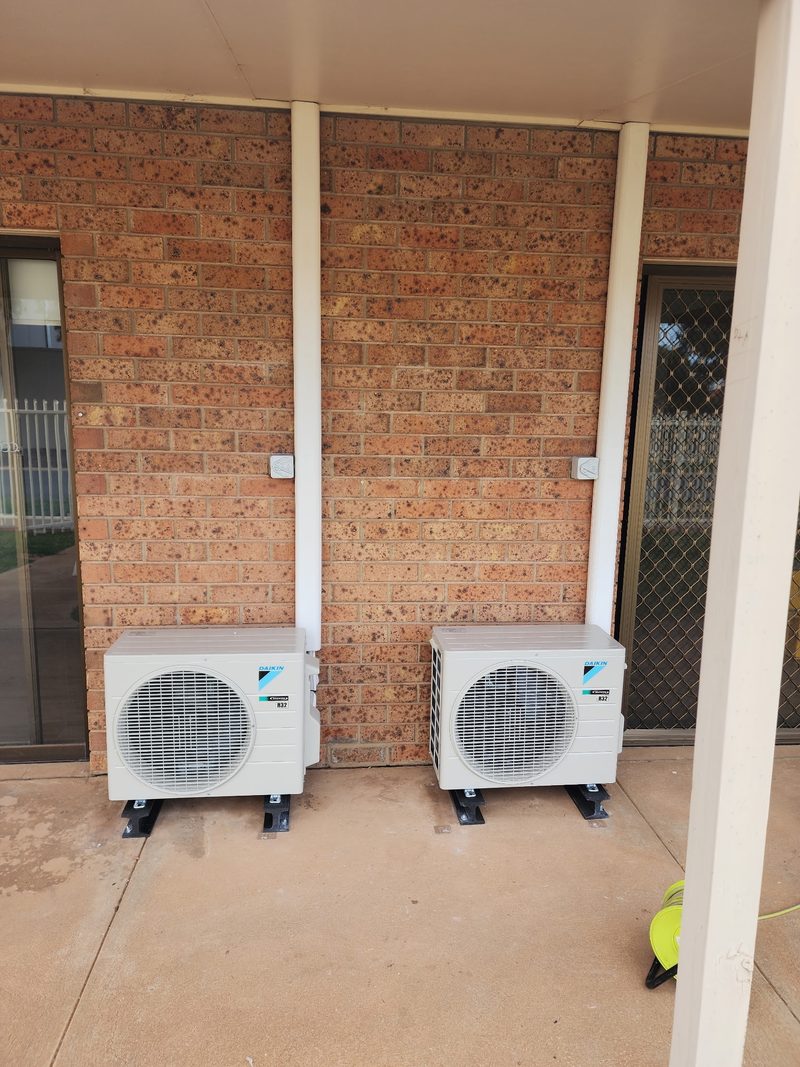 Twin Daikin split systems on a brick home