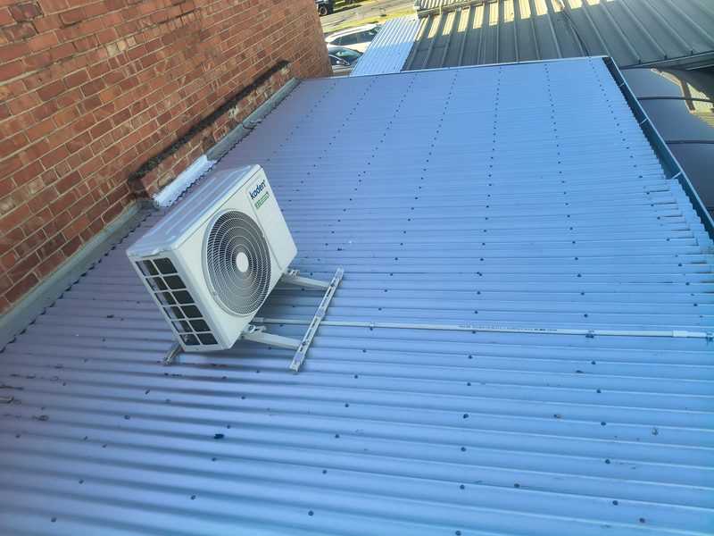 Split system mounted above a Colorbond roof